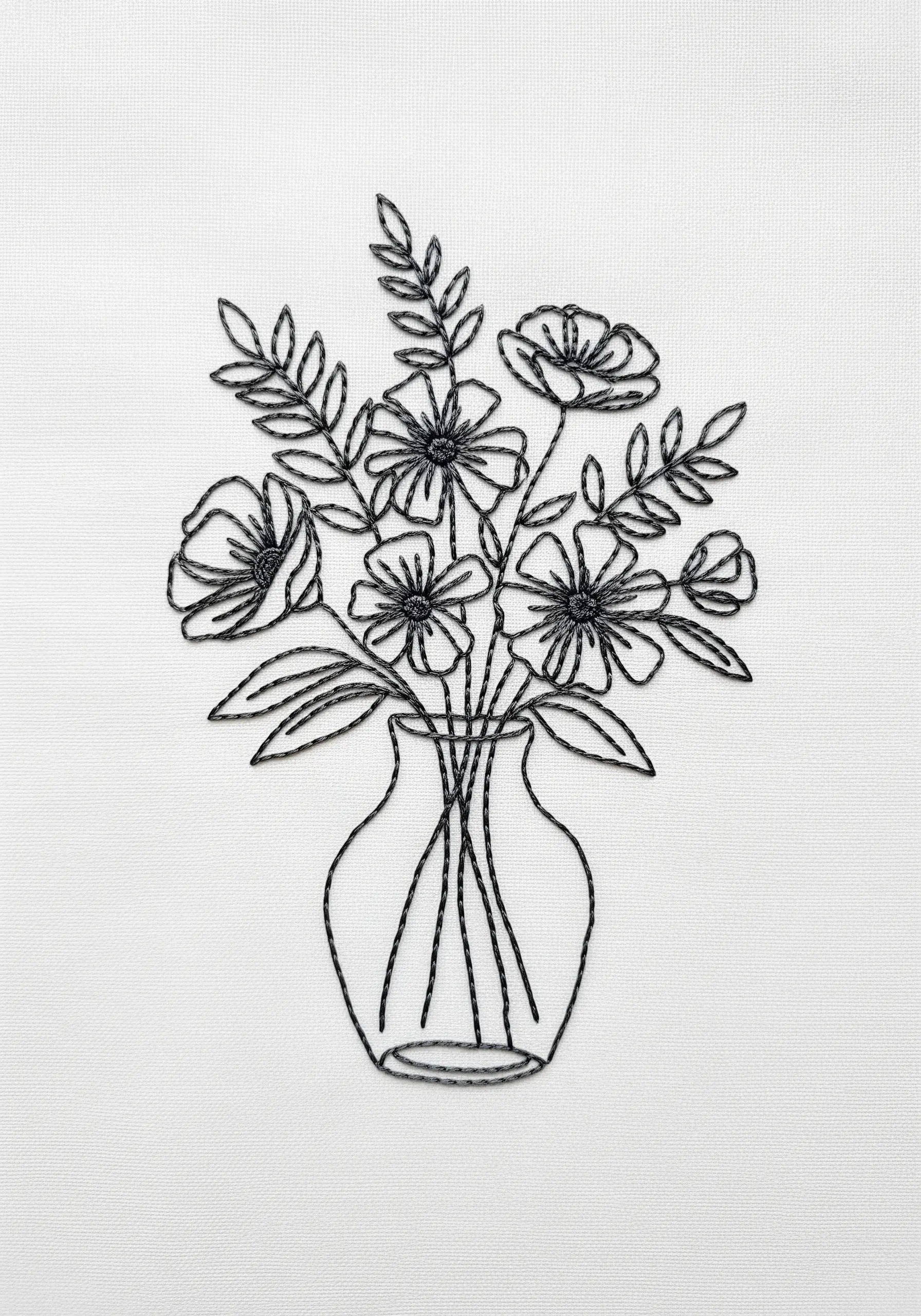 A line art embroidery of a flower bouquet in a glass vase, stitched in black thread.