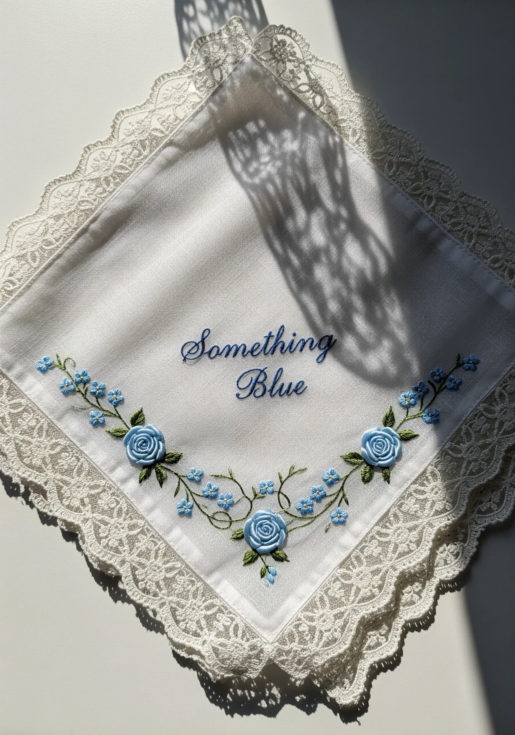 Blue script embroidery with tiny flowers on handkerchief