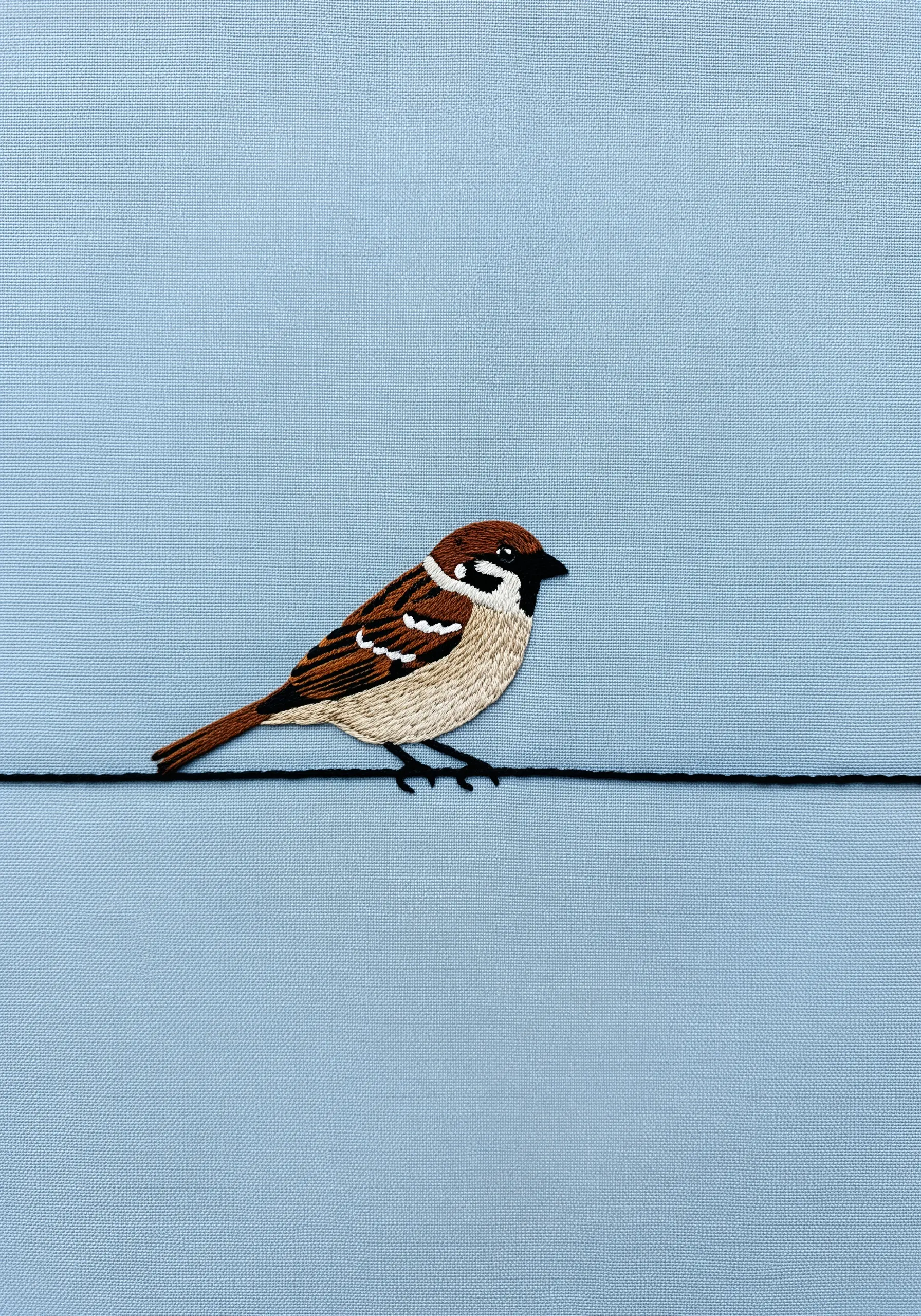 Realistic sparrow embroidery on a wire using thread painting techniques