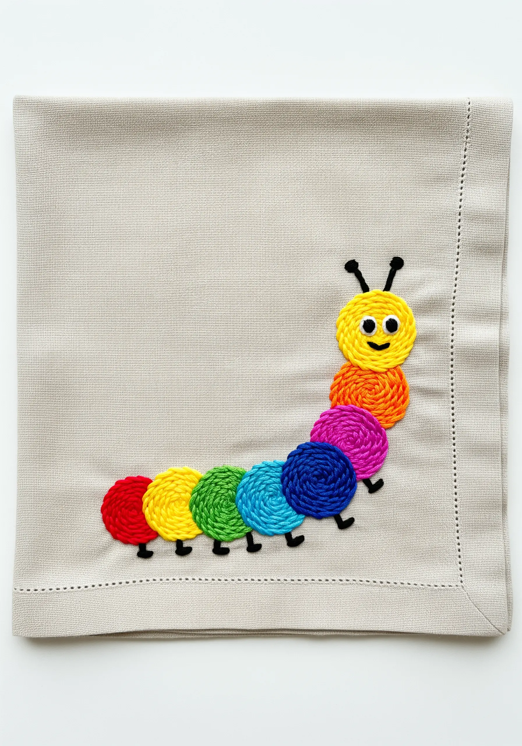 A colorful caterpillar with body segments made of spiraled rainbow thread.