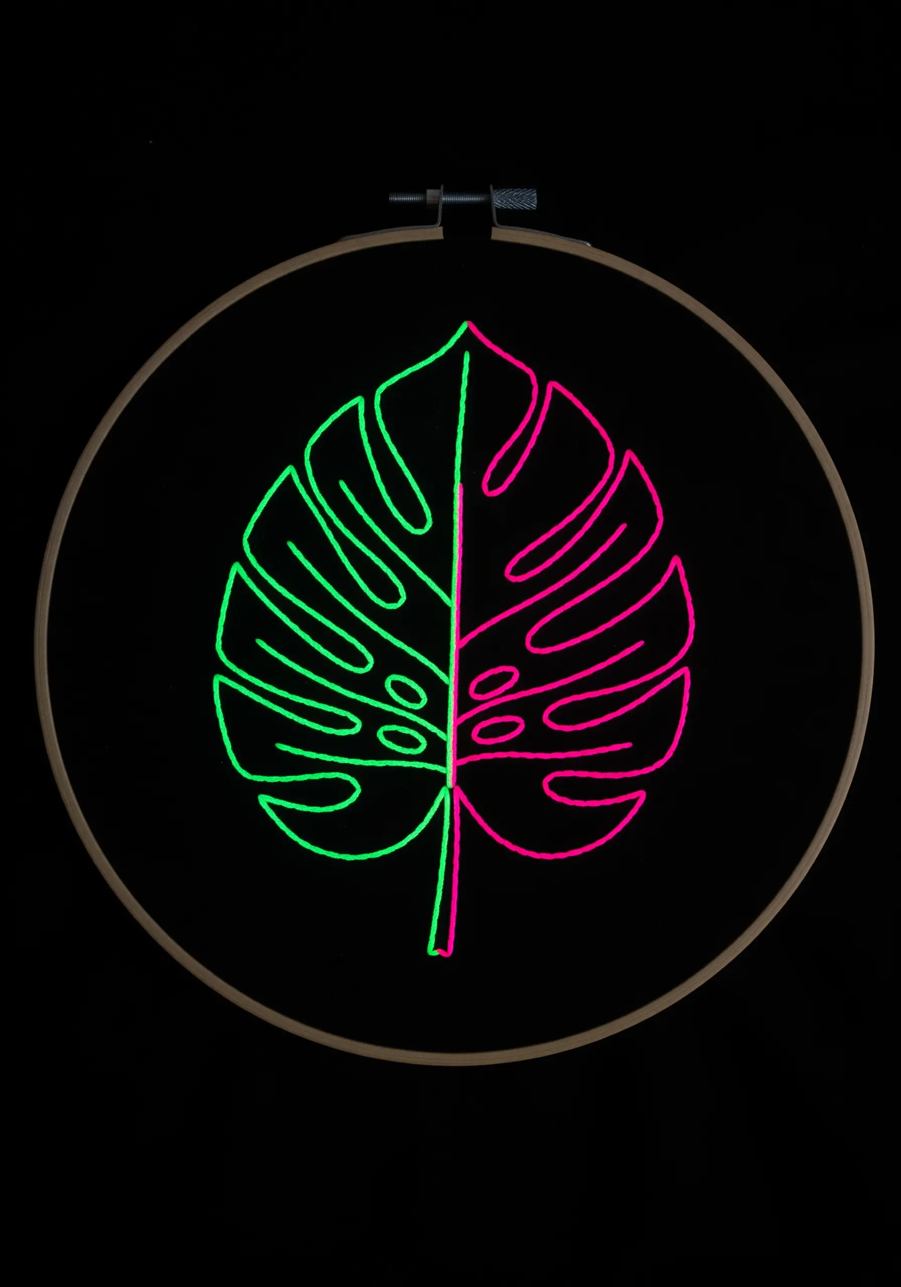 A simple outline of a monstera leaf, split into neon green and neon pink.
