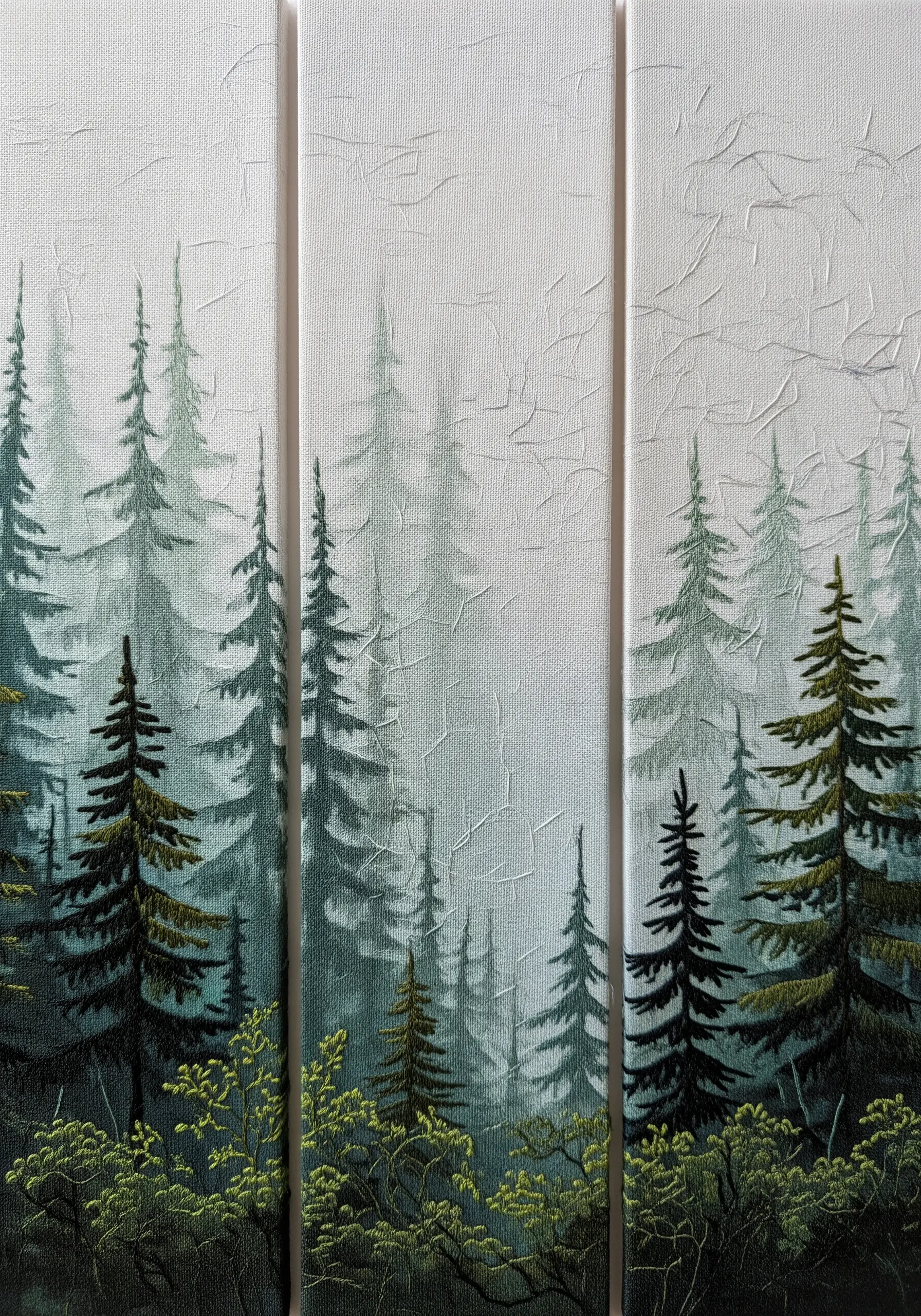 Embroidery triptych of a misty evergreen forest, showing depth and atmosphere.