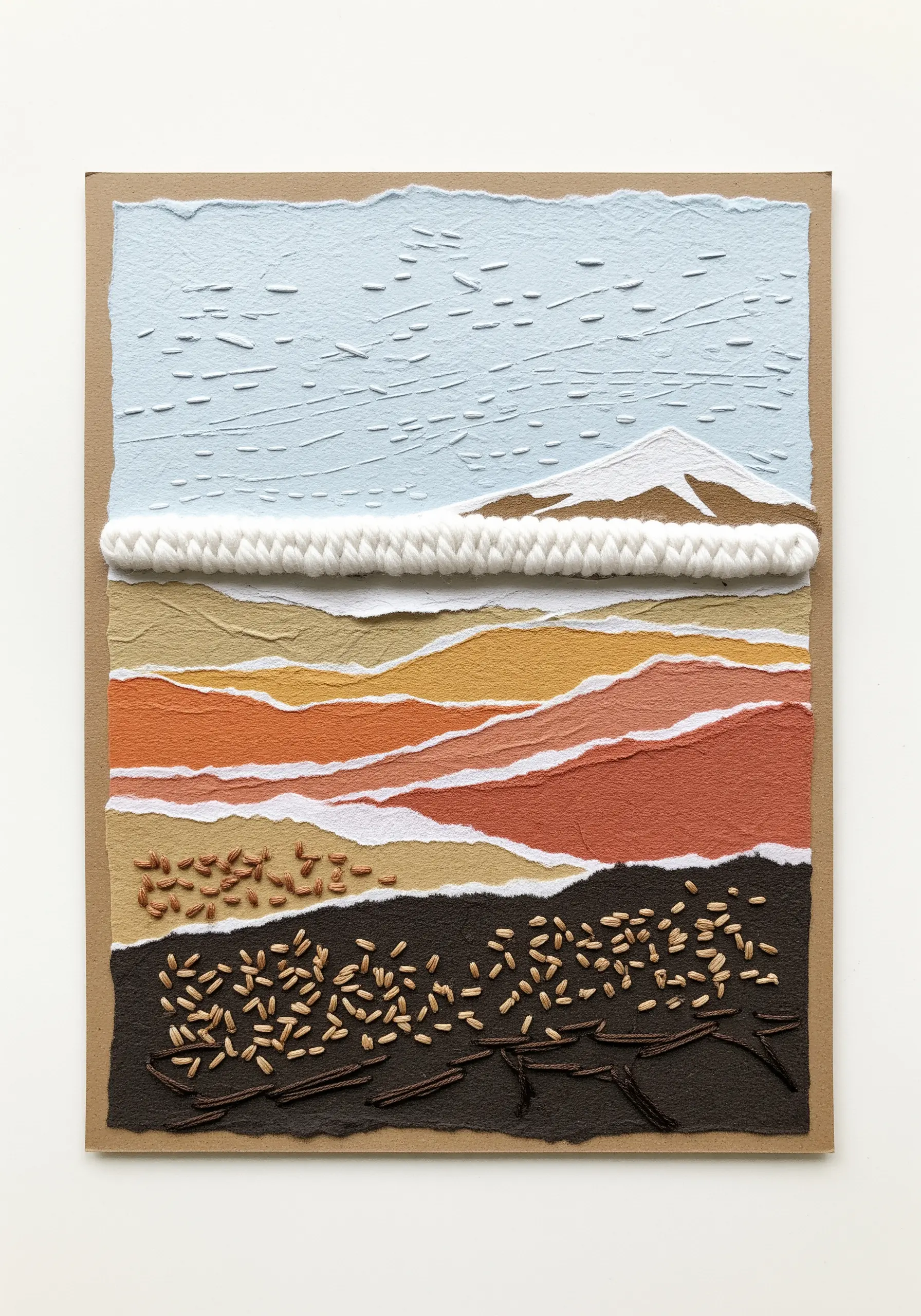 Mixed media landscape collage with torn paper, couched yarn, and embroidered seed details.