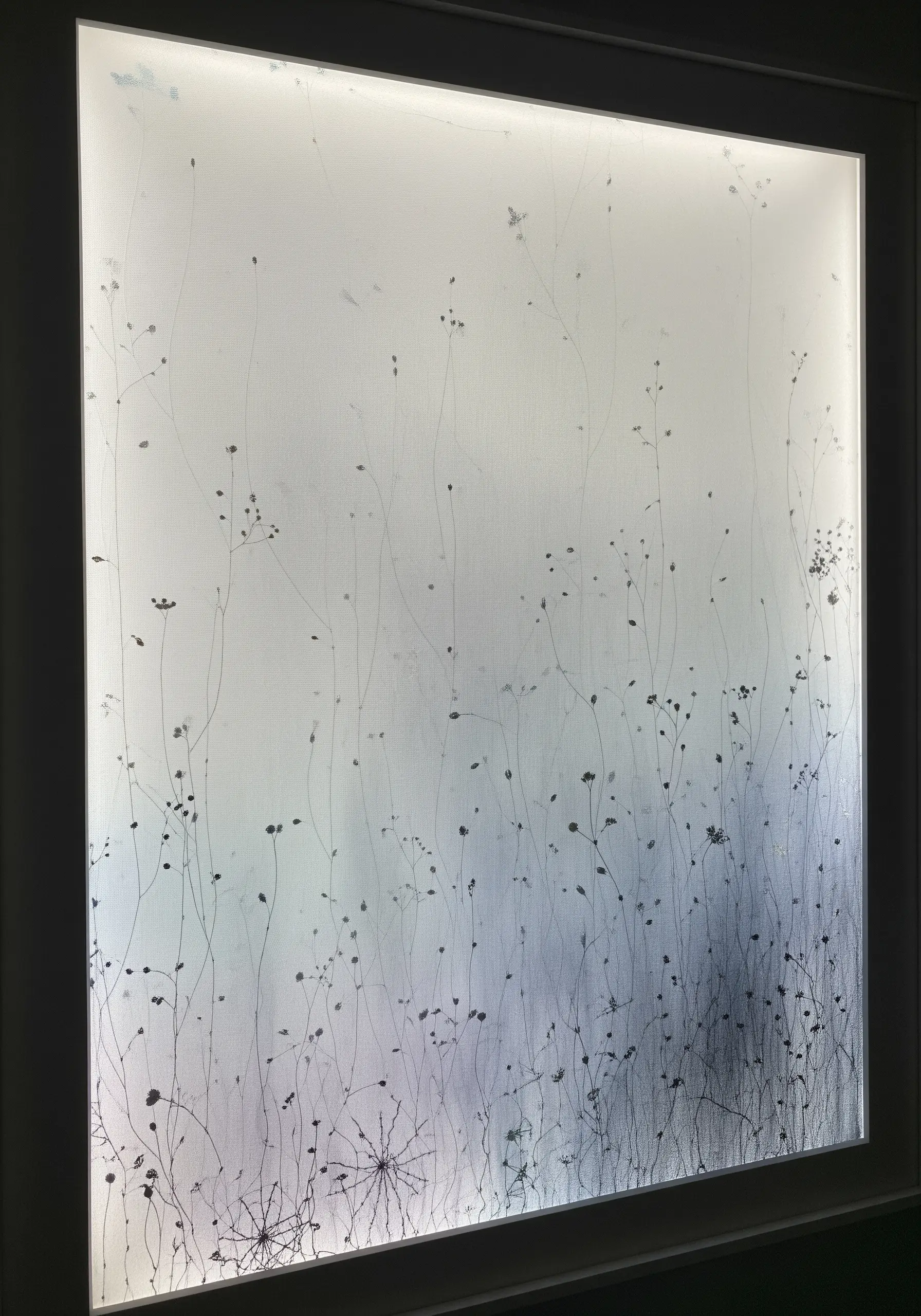 Backlit embroidery of delicate wildflowers, with the density creating a gradient effect.