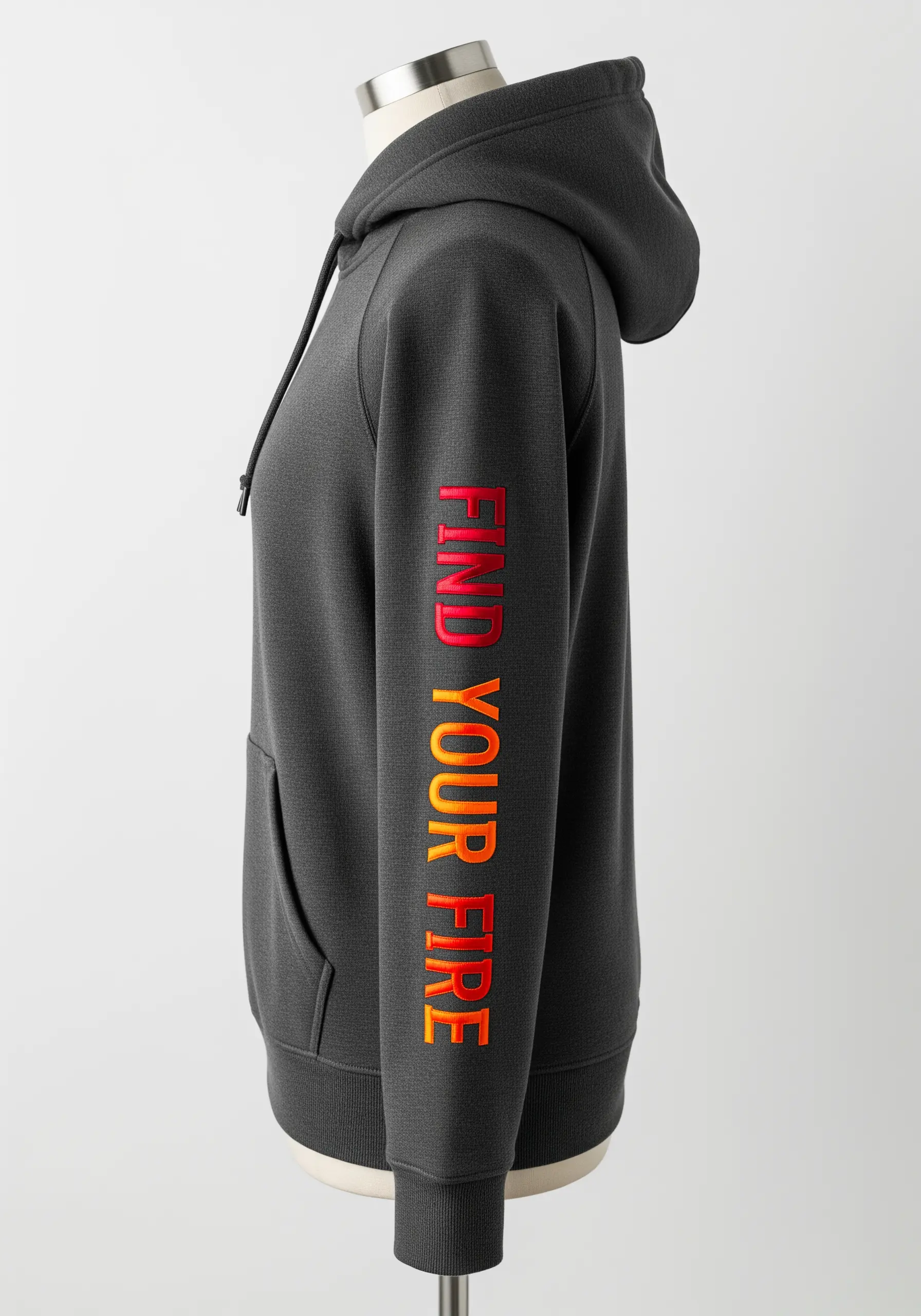 “Find Your Fire” embroidered in a red-to-orange gradient on a dark hoodie sleeve.