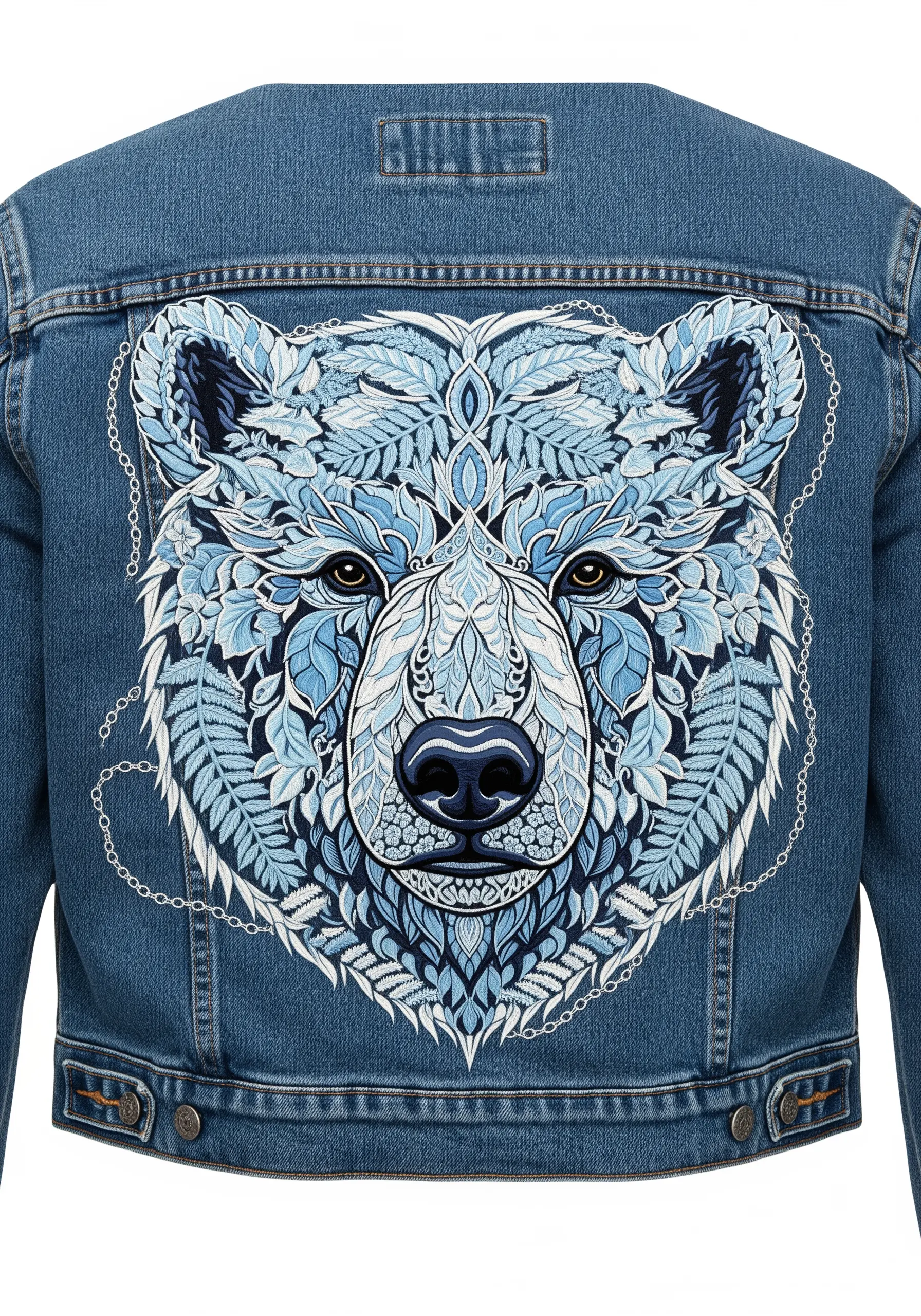 An intricate, mandala-style polar bear face embroidered in shades of blue on a denim jacket back.