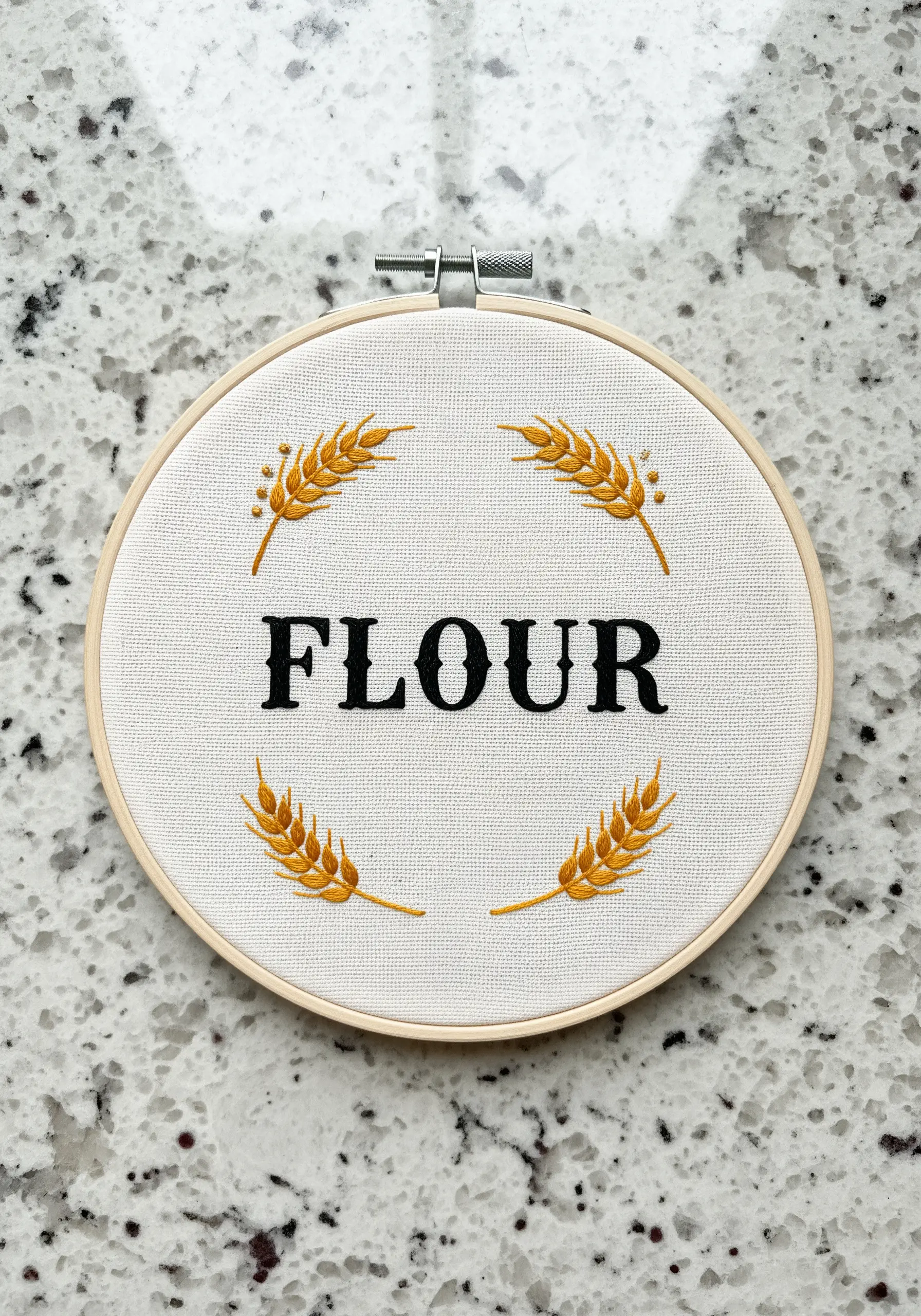 Flour label embroidery with serif typography and wheat borders