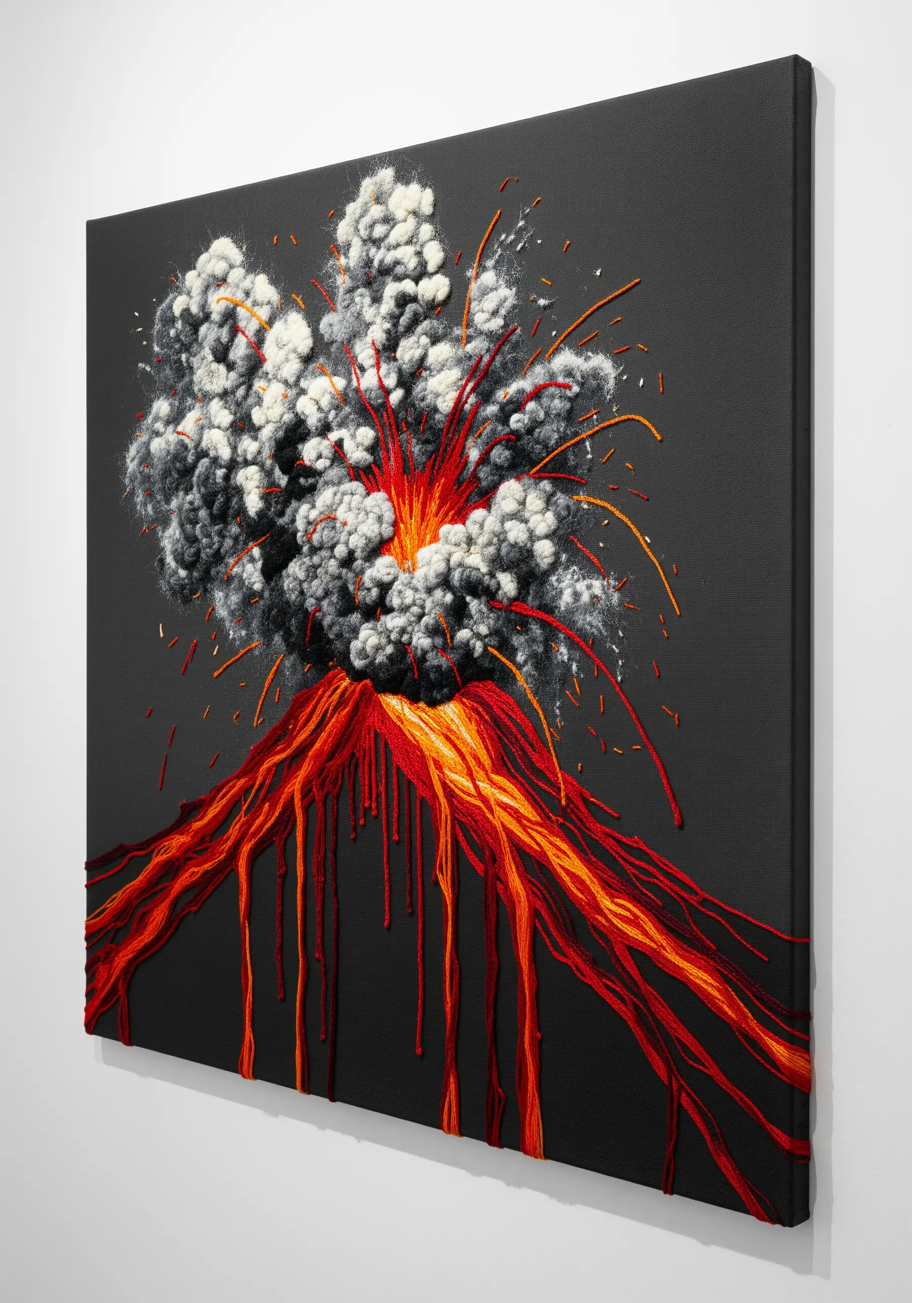 A 3D embroidery of a volcanic eruption with fluffy smoke clouds and loose red lava threads.