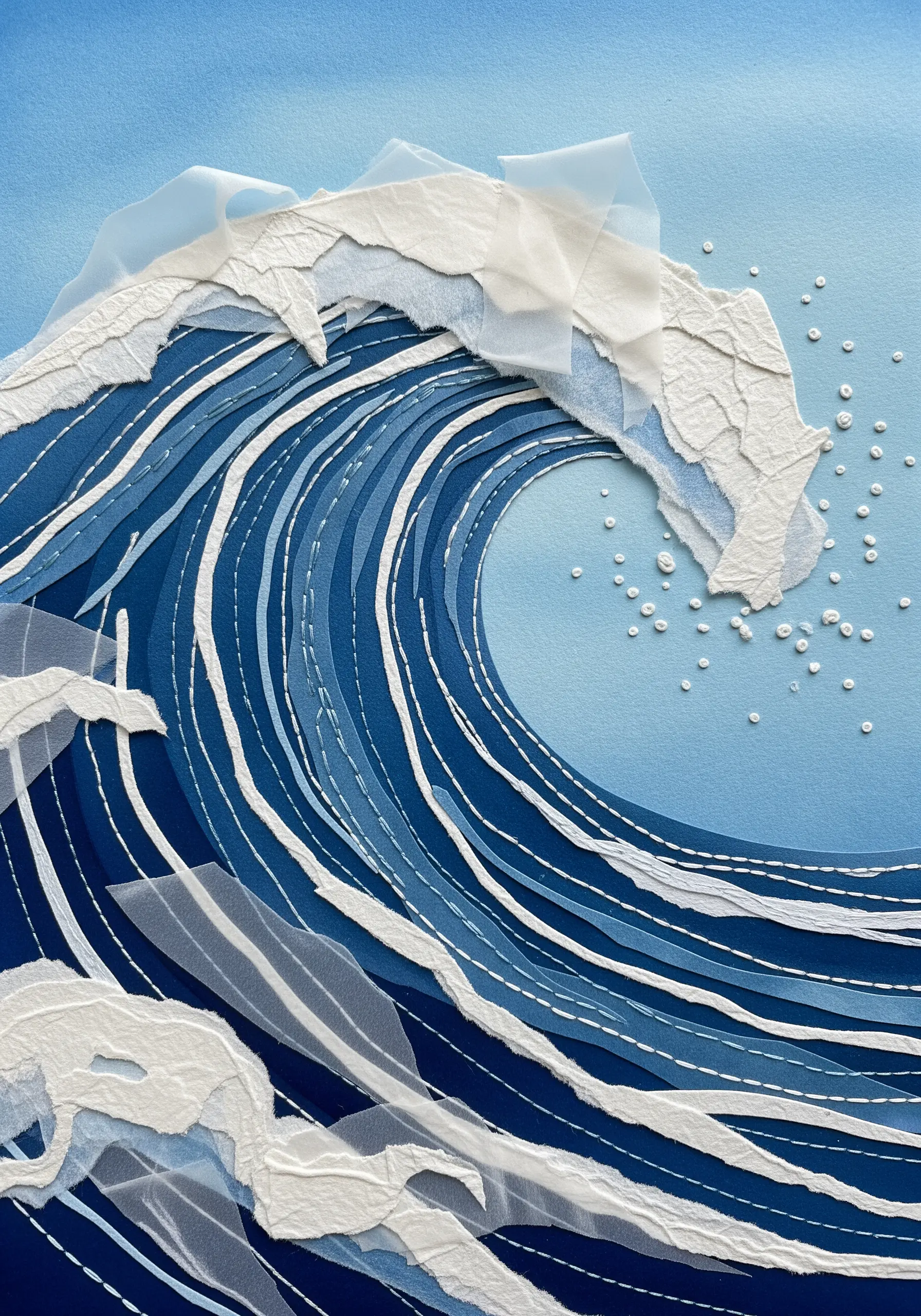 Paper collage of an ocean wave with white stitches following the curves to show movement.