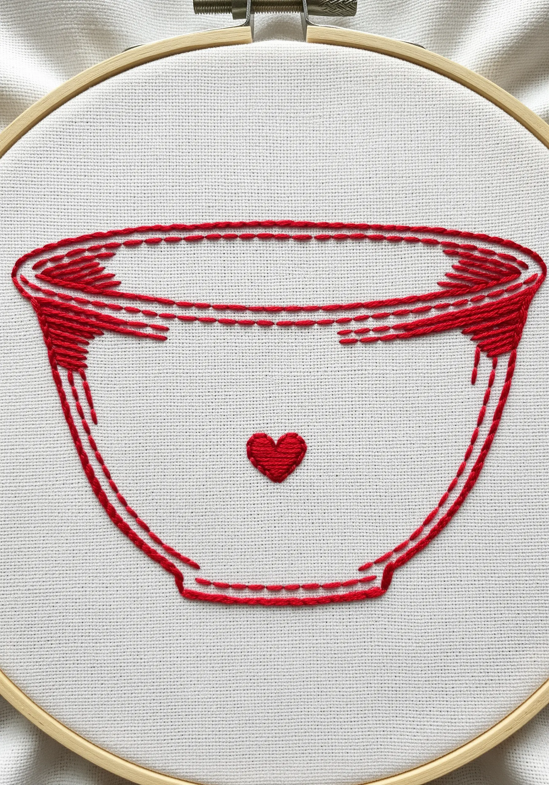 Red line art embroidery of a vintage mixing bowl