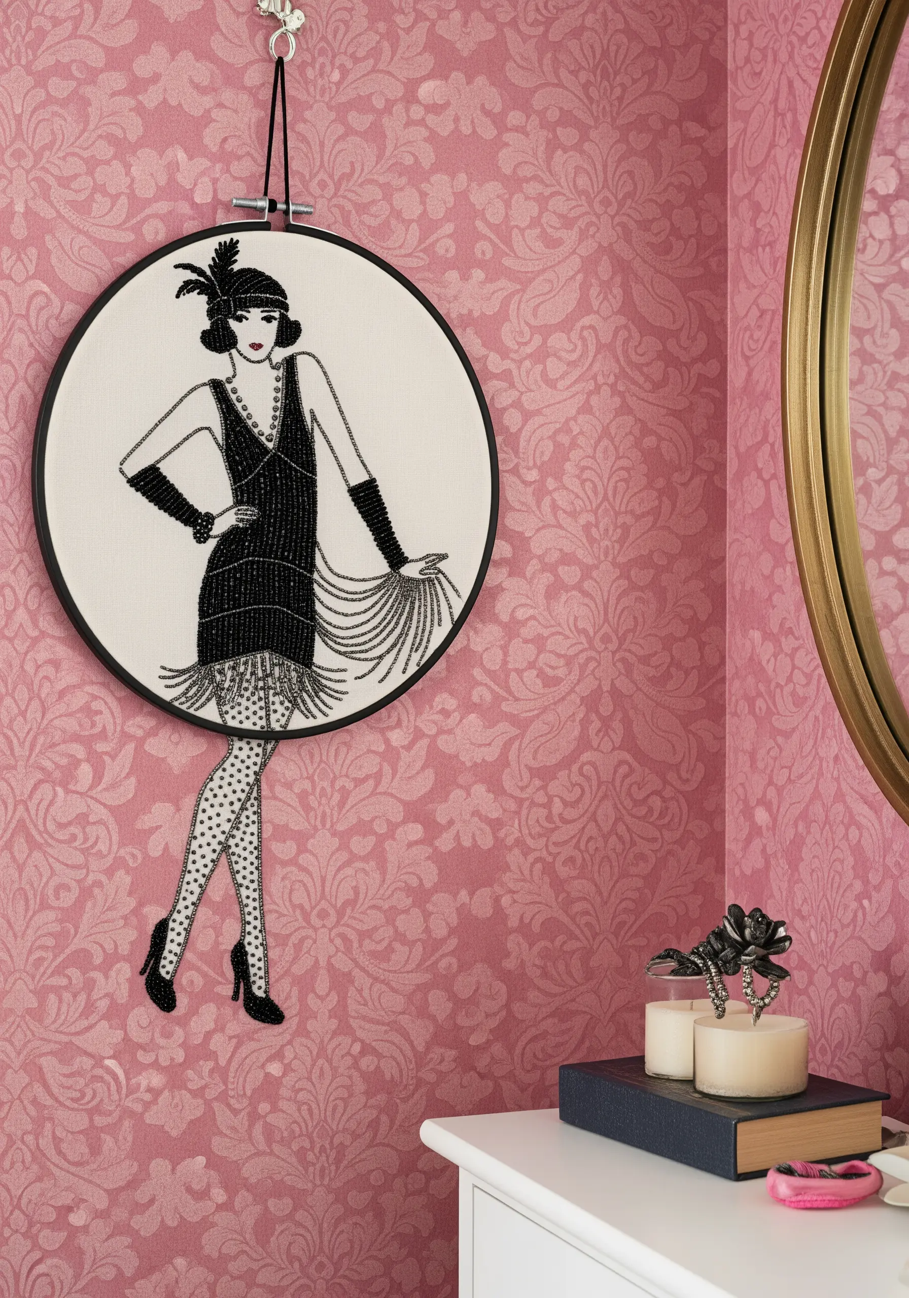 A hoop art embroidery of a 1920s flapper girl, with her black dress detailed in seed beads.