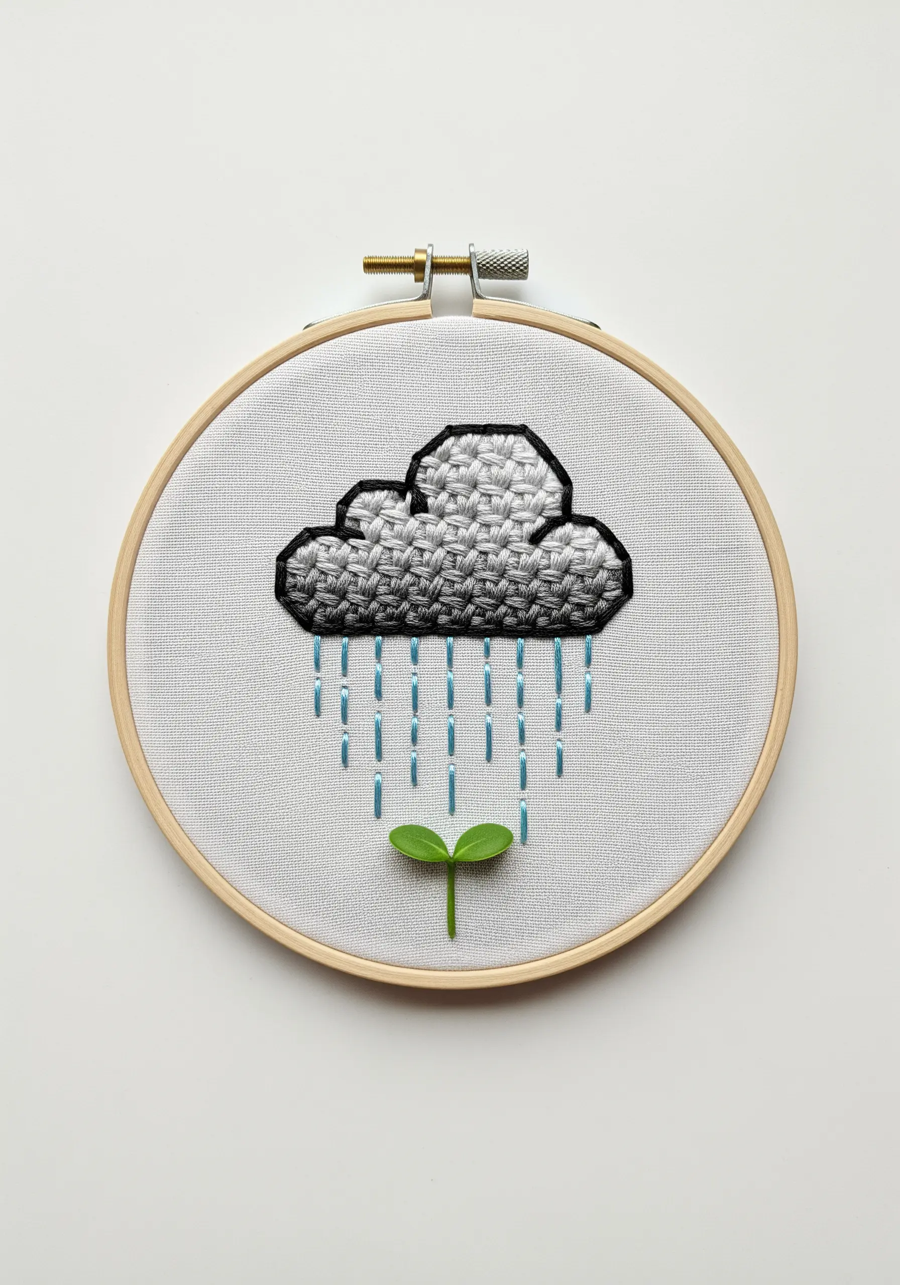 A cloud with a woven fill stitch, outlined in black, with blue rain stitches.
