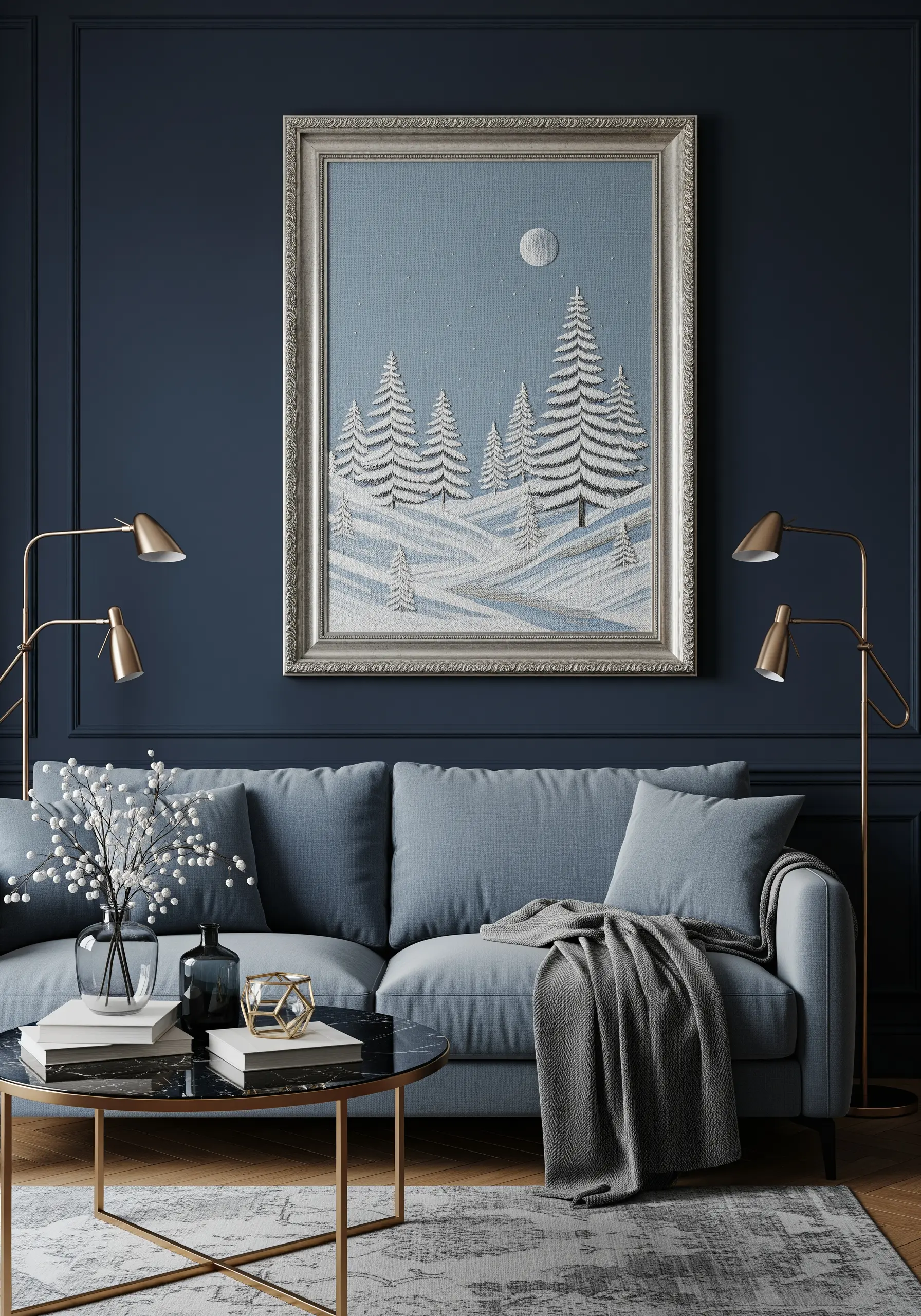 A large framed embroidery of a serene, snowy landscape with white trees against a deep blue wall.