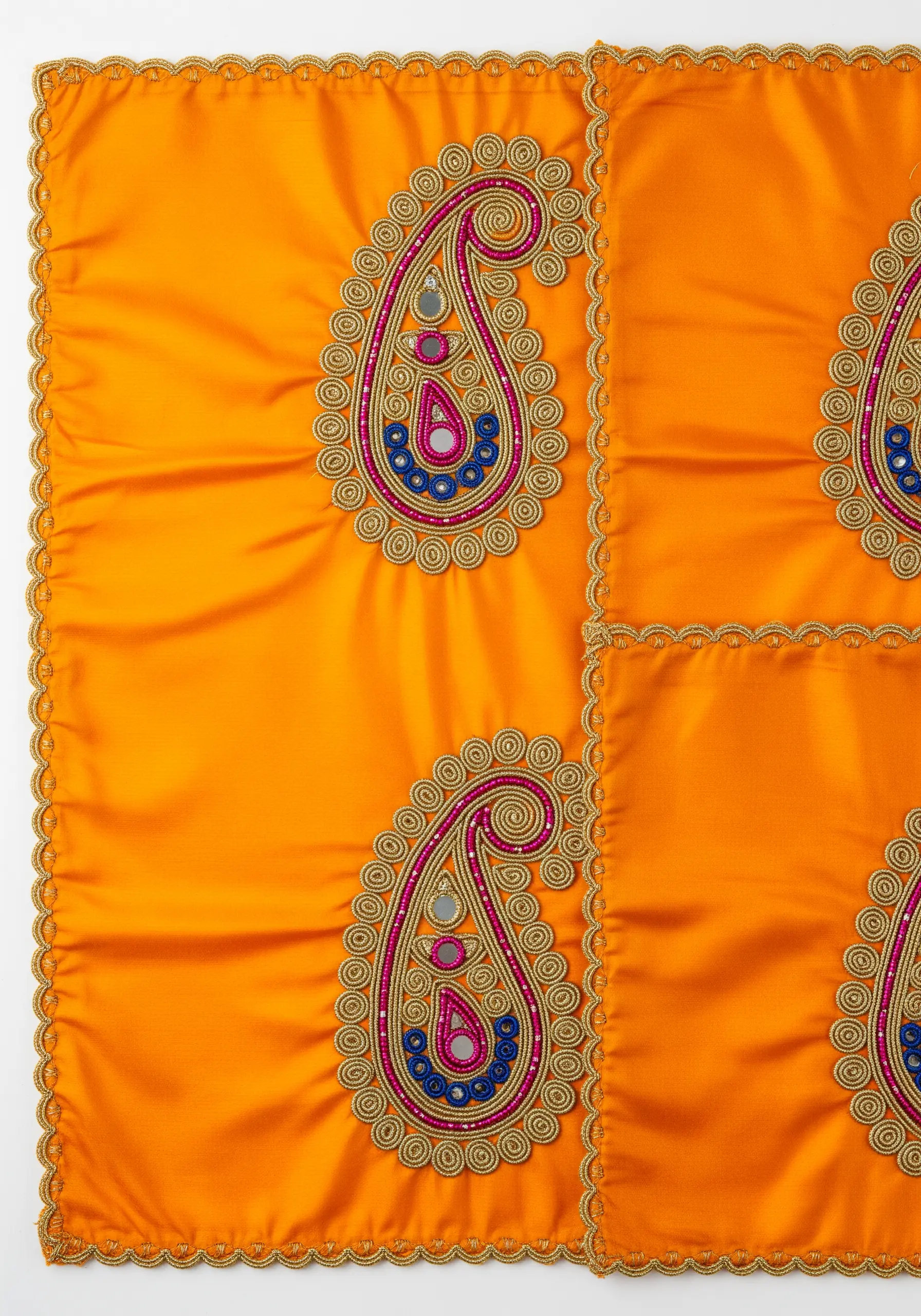 Detailed Zardozi-style paisley motif with couched gold cord and beadwork on silk.